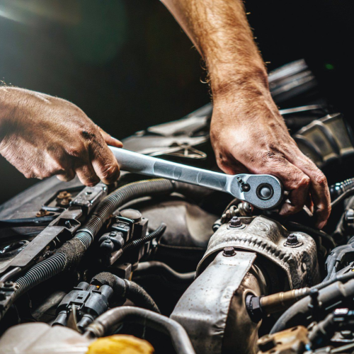 mechanic working on engine