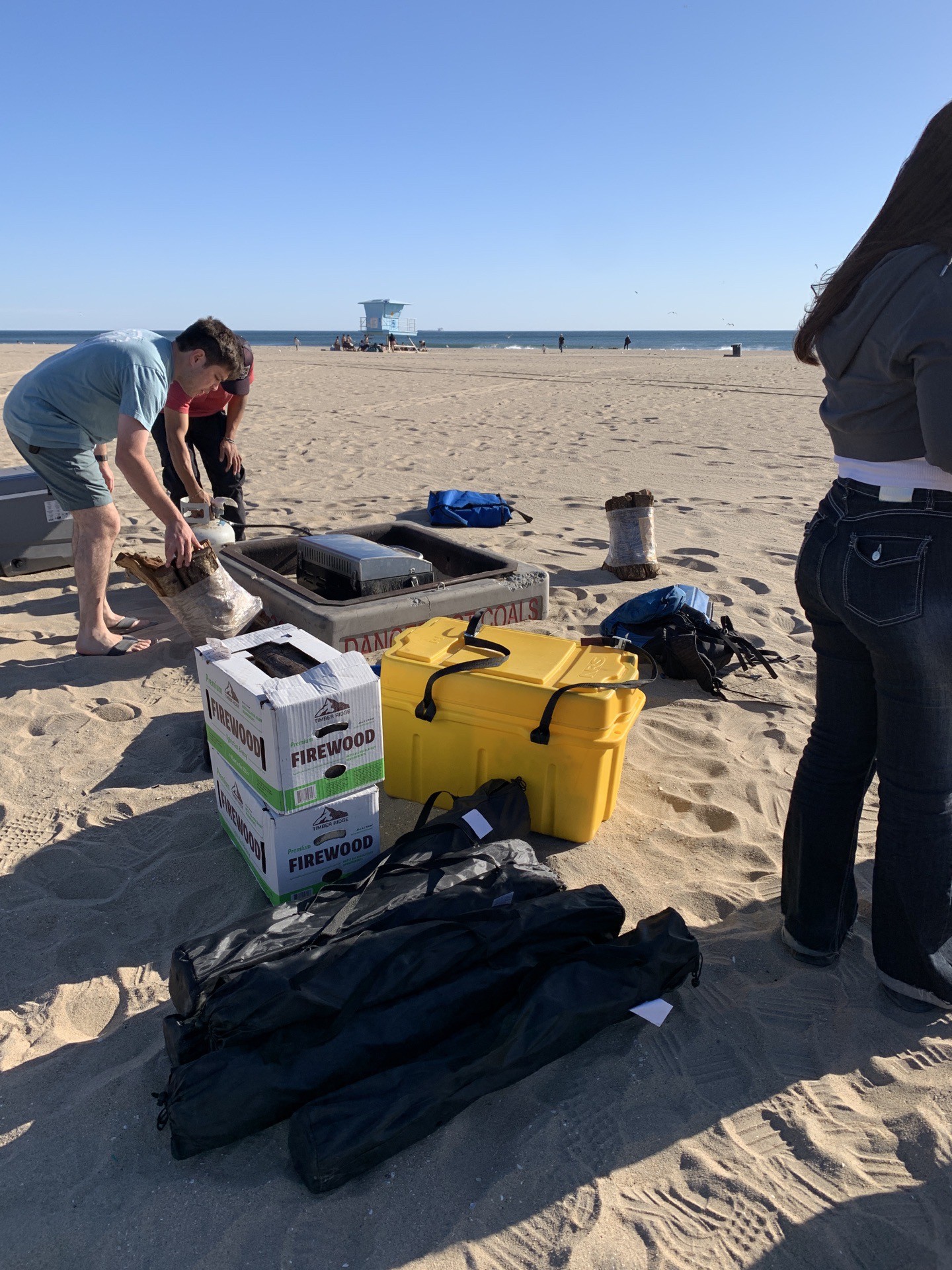 setting up fire on the beach