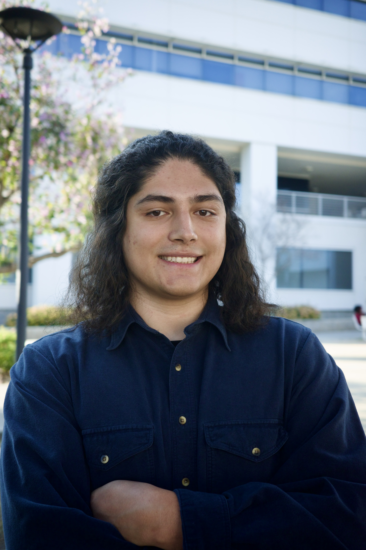 Pathways Mentor Rafael Herrera in front of the Social and Behavioral Sciences Building at CSUSB