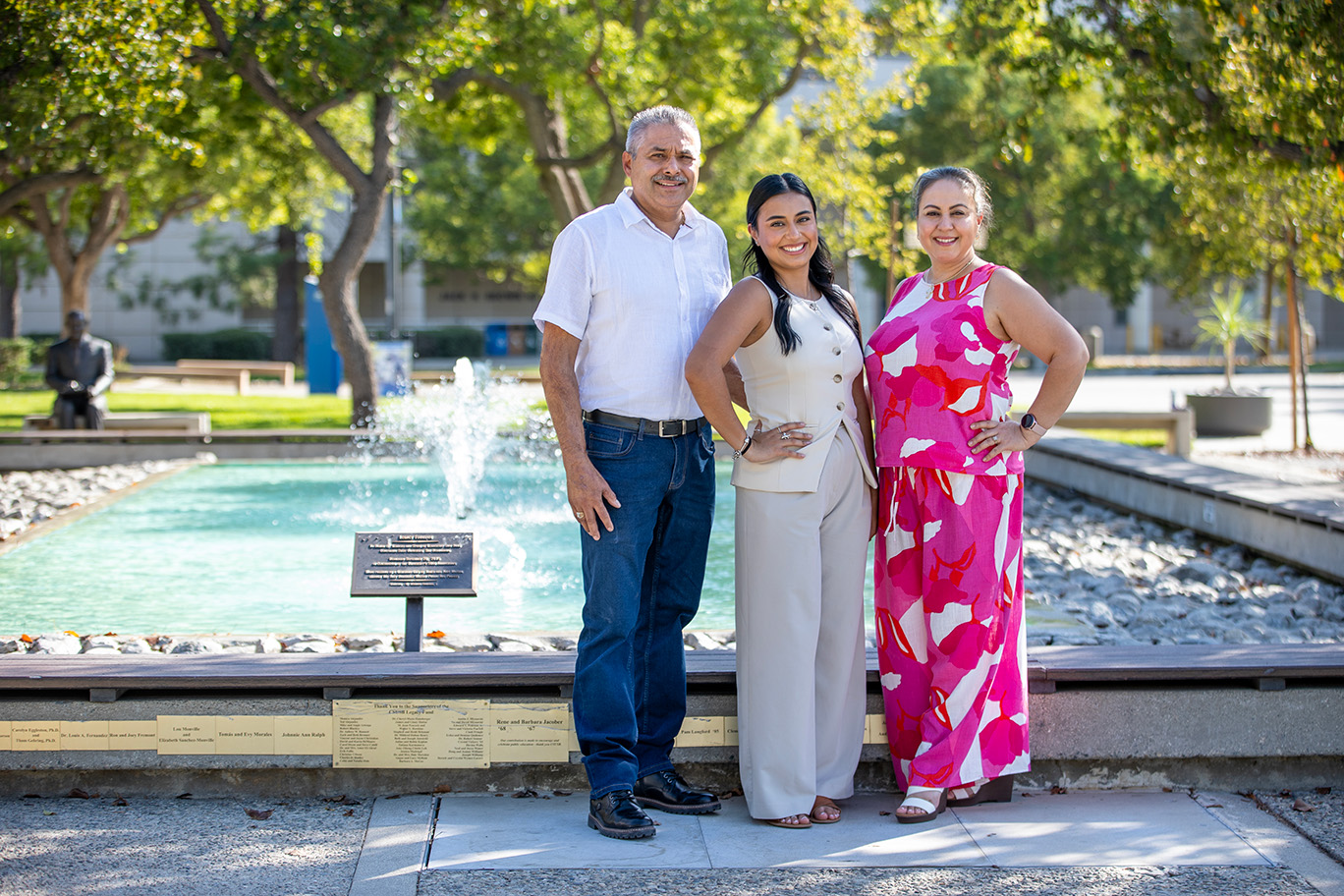 Angela Padilla Vidarte, center, with her parents, Saul and Ana Padilla, whose support and advocacy helped shape her journey and the work she now does with CSUSB families.