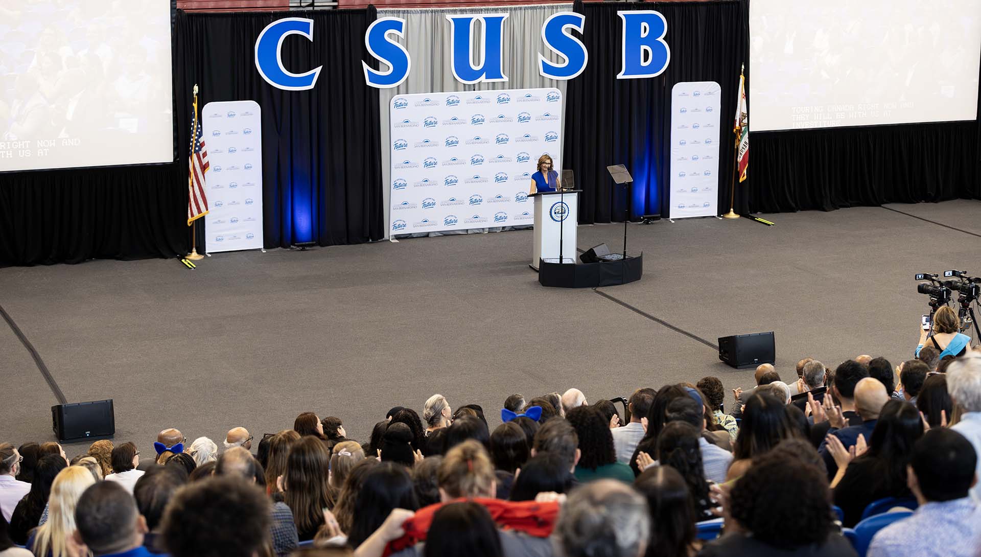 President Terri Gomez speaks at the 2026 Convocation in Coussoulis Arena.