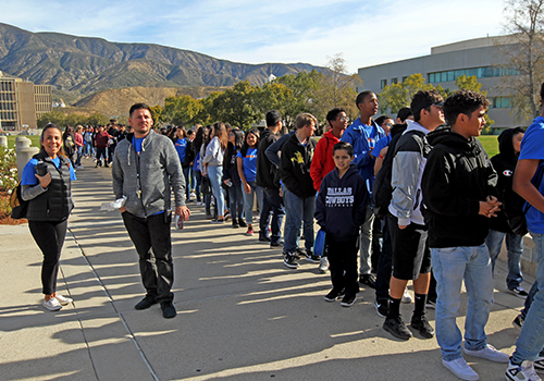 Image of people in a line on CSUSB campus