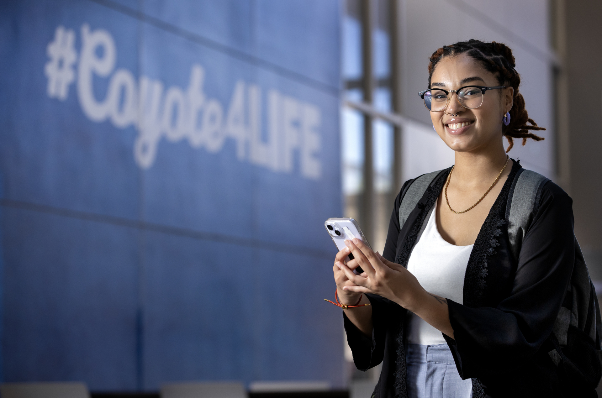 Student holding cell phone