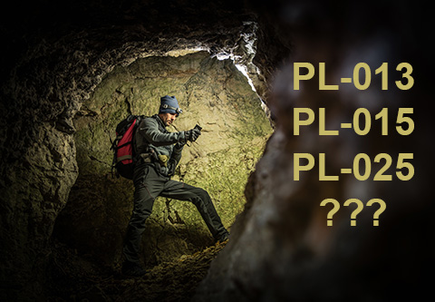 Man exploring a dark cave.