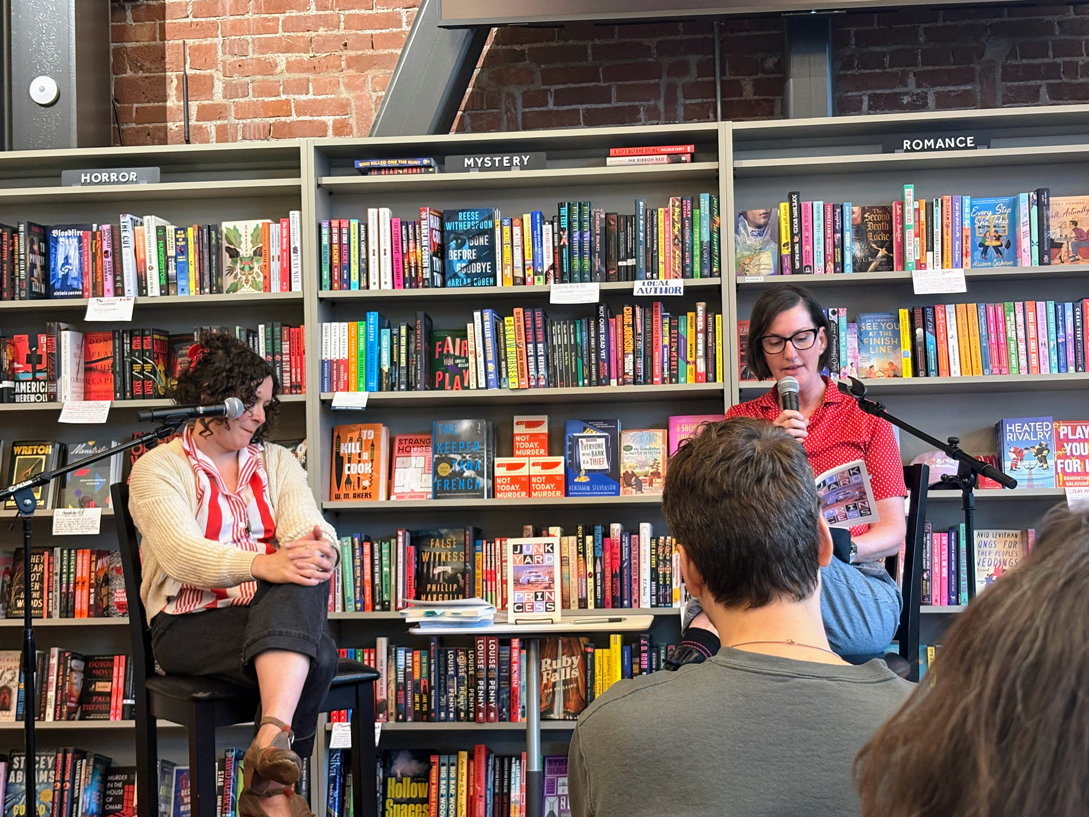 CSUSB alumna and author Robyn Saunders Wilson, at right, reads a portion of her book, “Junkyard Princess.”
