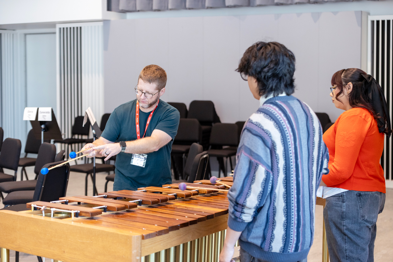 An instructor teaches students about instruments.
