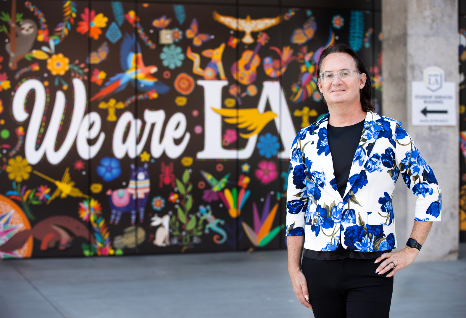 Hollins, on the Cal State LA campus, posing with the “We Are LA” mural in the background.
