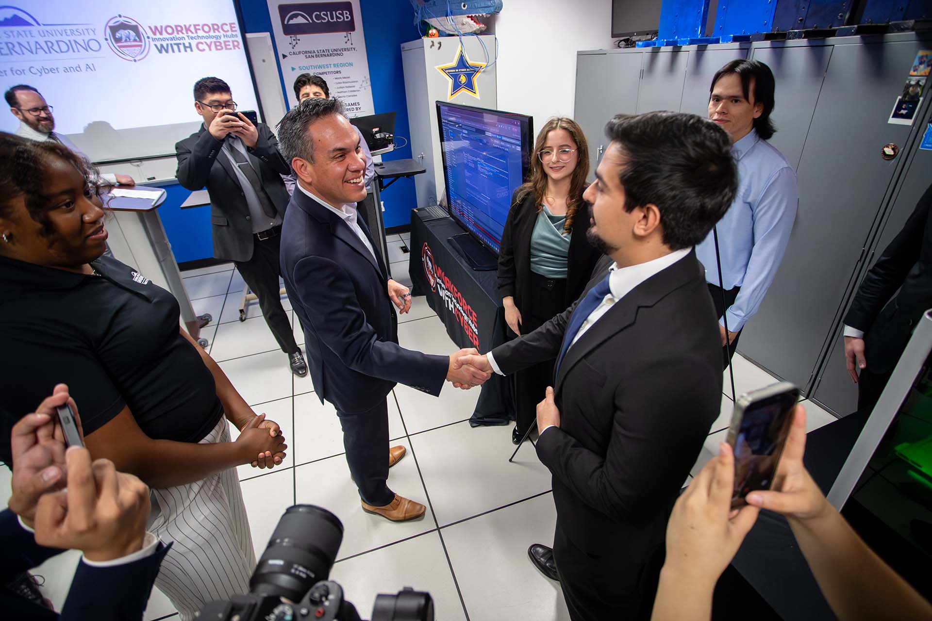 U.S. Rep. Pete Aguilar (center) meets with students at Cal State San Bernardino’s Center for Cyber and AI.
