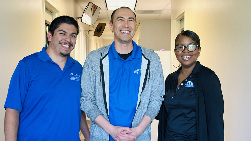 Markin was all smiles with previous Outstanding Professional Academic Advisor Award recipients, Arturo Gutierrez (far left), program admissions advisor, and Reneisha Wilkes, EOP Renaissance Scholars Program coordinator.
