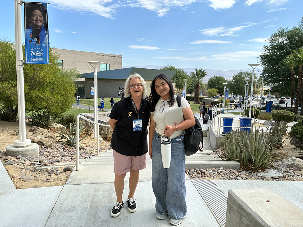 Lacey Kendall, lecturer in the Department of Media and Communications, welcomes a student at the CSUSB Palm Desert Campus.&nbsp;