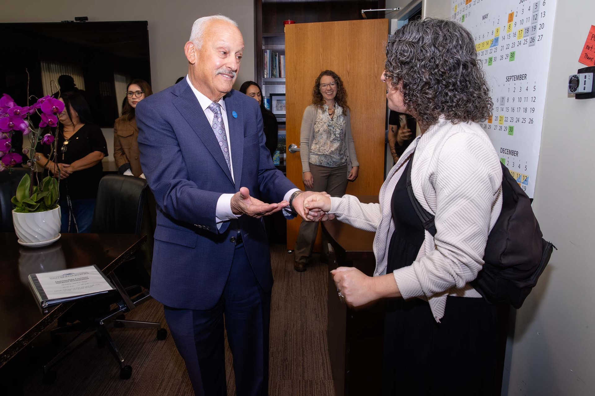 University President Tomás D. Morales (left) congratulates Jessica Nerren on being named the recipient of the 2025-26 Outstanding Lecturer Award.