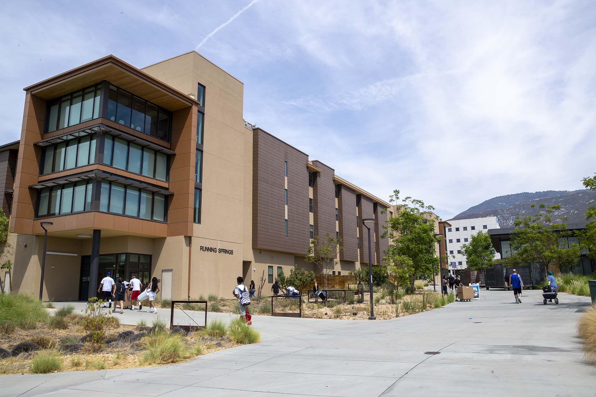 Students move into one of the dorms at Coyote Village.