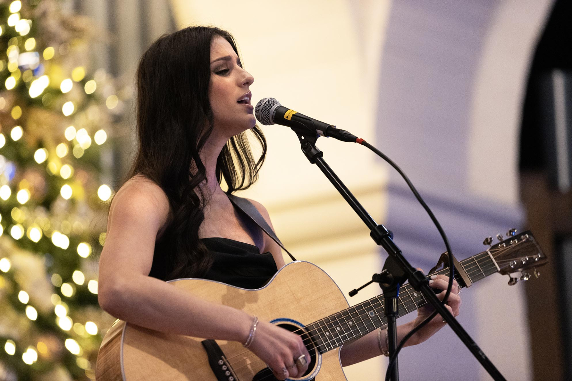 Abi Carter, a CSUSB Palm Desert Campus graduate and the American Idol Season 22 winner, performs at the President's Holiday Dinner at the Mission Inn in Riverside on Dec 7, 2024. 