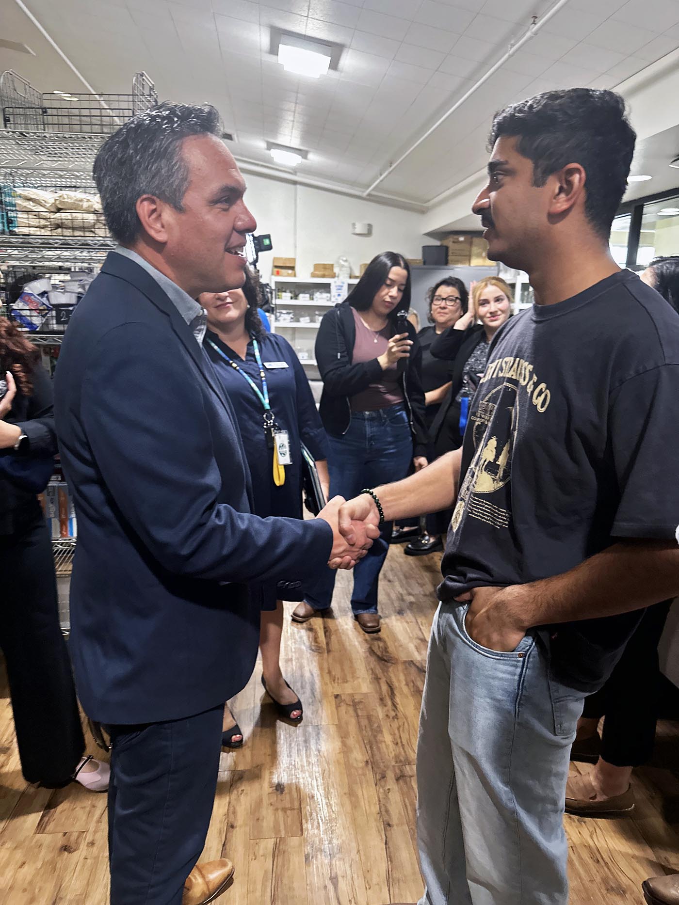 U.S. Rep. Pete Aguilar meets with a student during a visit to CSUSB’s Obershaw DEN food pantry. Aguilar highlighted the importance of food assistance program during his visit to the university. Photo courtesy of the Office of U.S. Rep. Pete Aguilar.