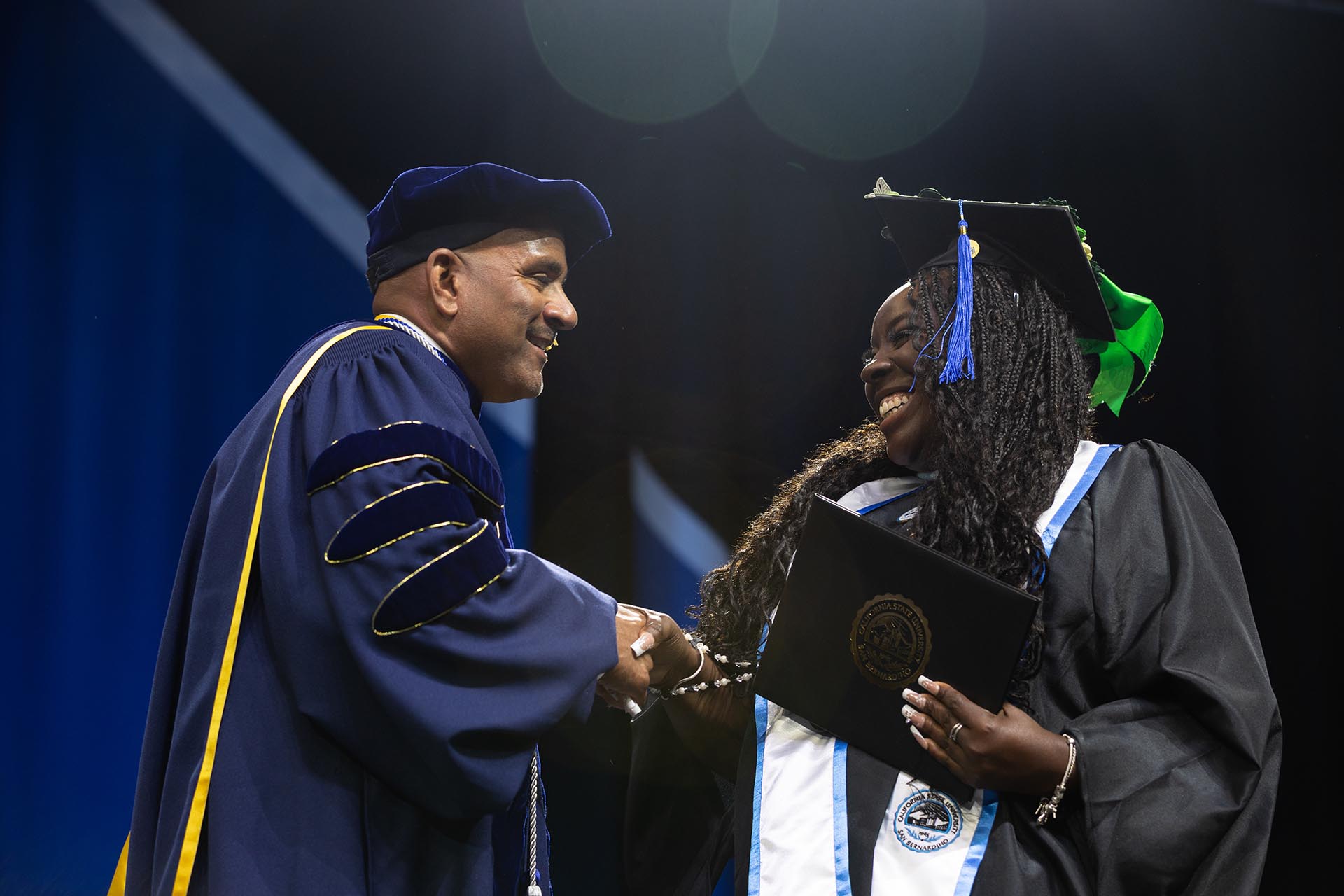 Provost Rafik Mohamed congratulates a graduate.