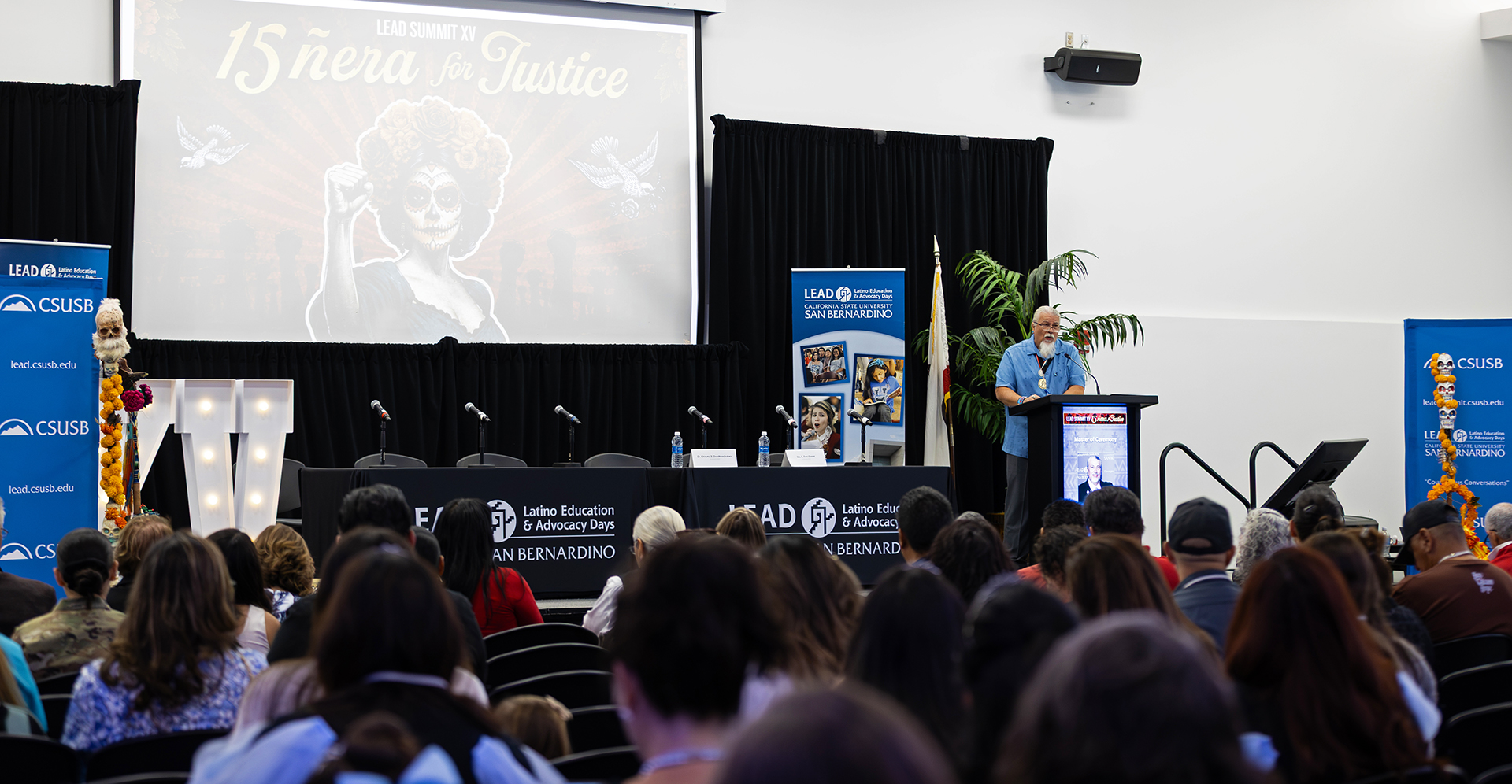 Enrique Murillo Jr., executive director of LEAD and CSUSB professor of education, at the podium during LEAD Summit XV.