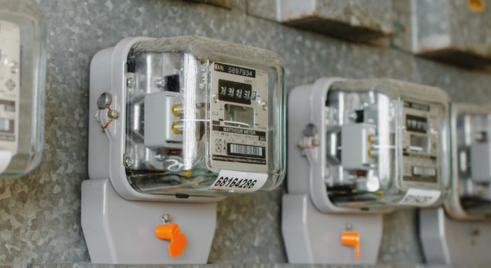 Row of wall-mounted electricity meters