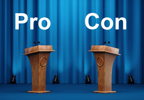 Pro, con.  Two lecterns on a stage.