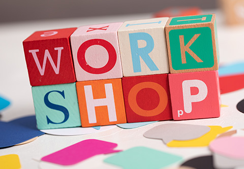 Workshop is spelled out in colorful blocks.