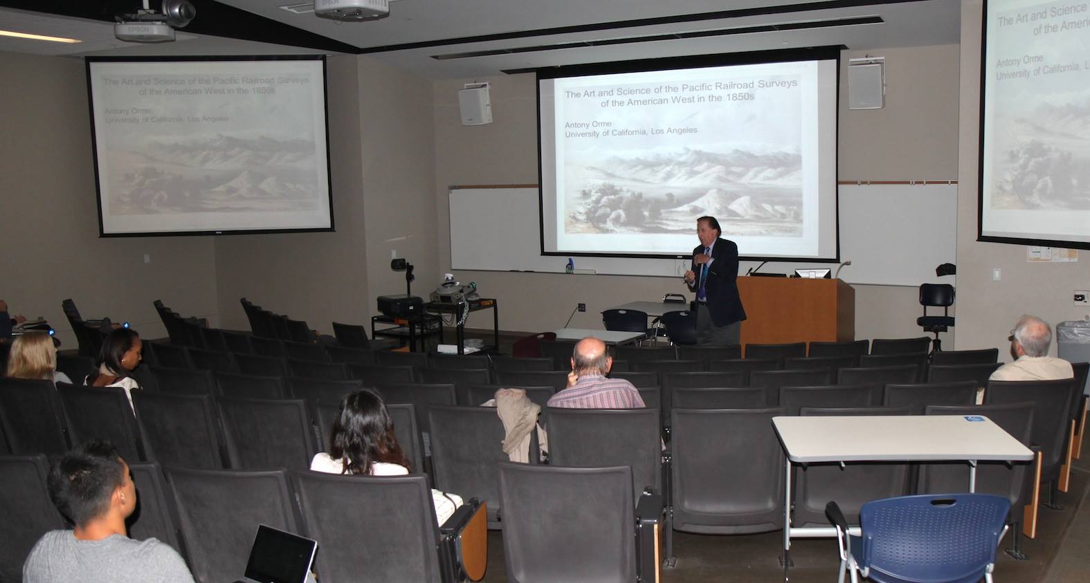 Guy lecturing to a lecture hall