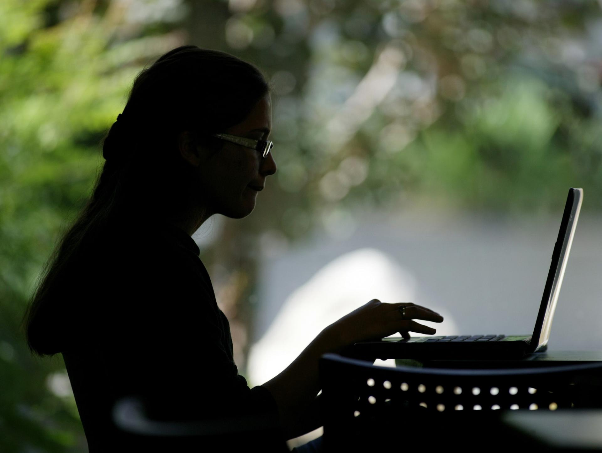 A student working on her laptop