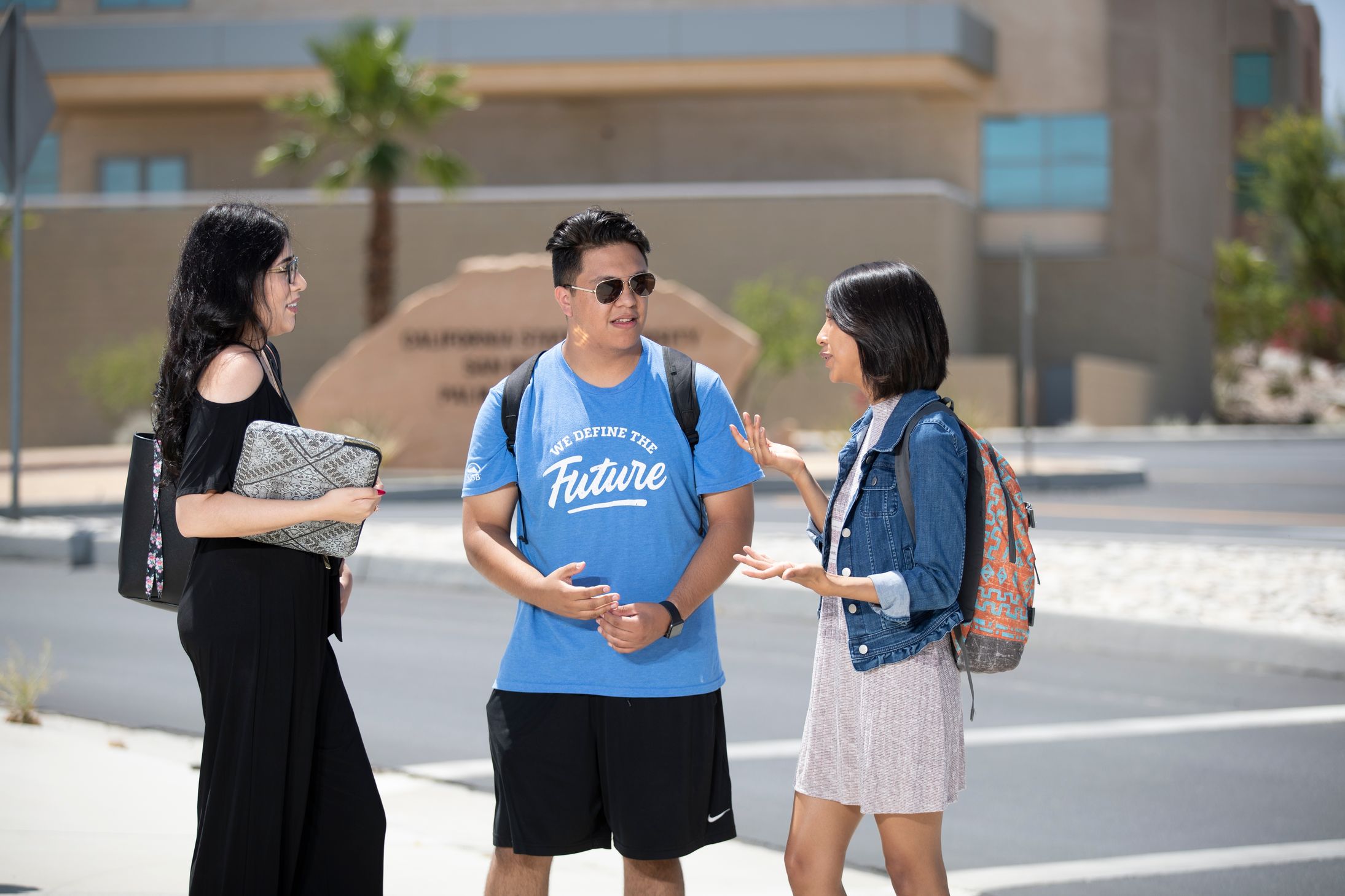 Students talking in front of PDC sign