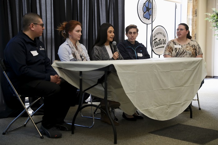 A group of Student Research siting at a table