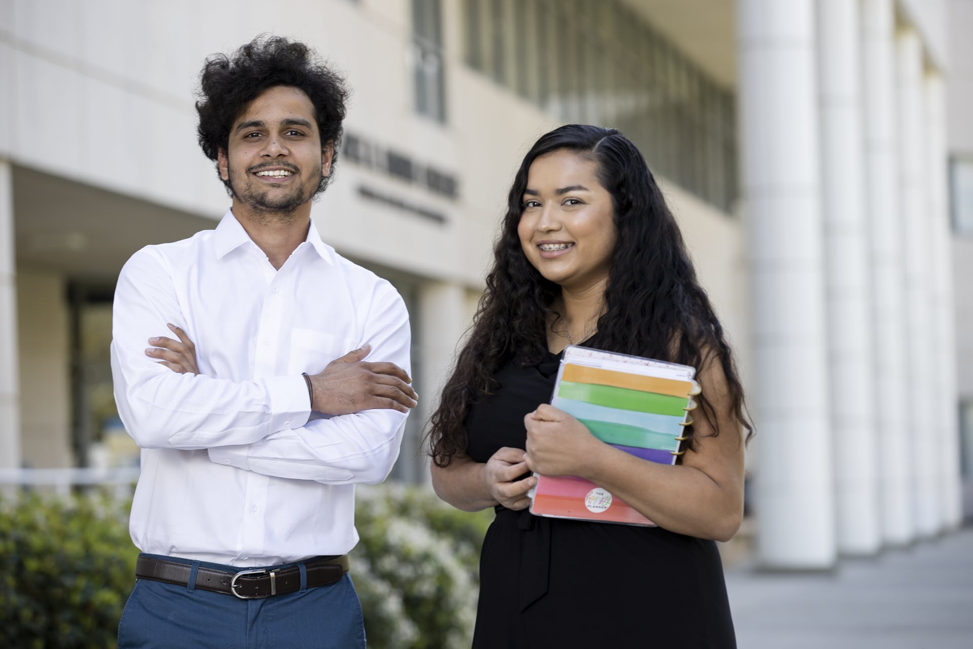 Two students standing outside JHBC.