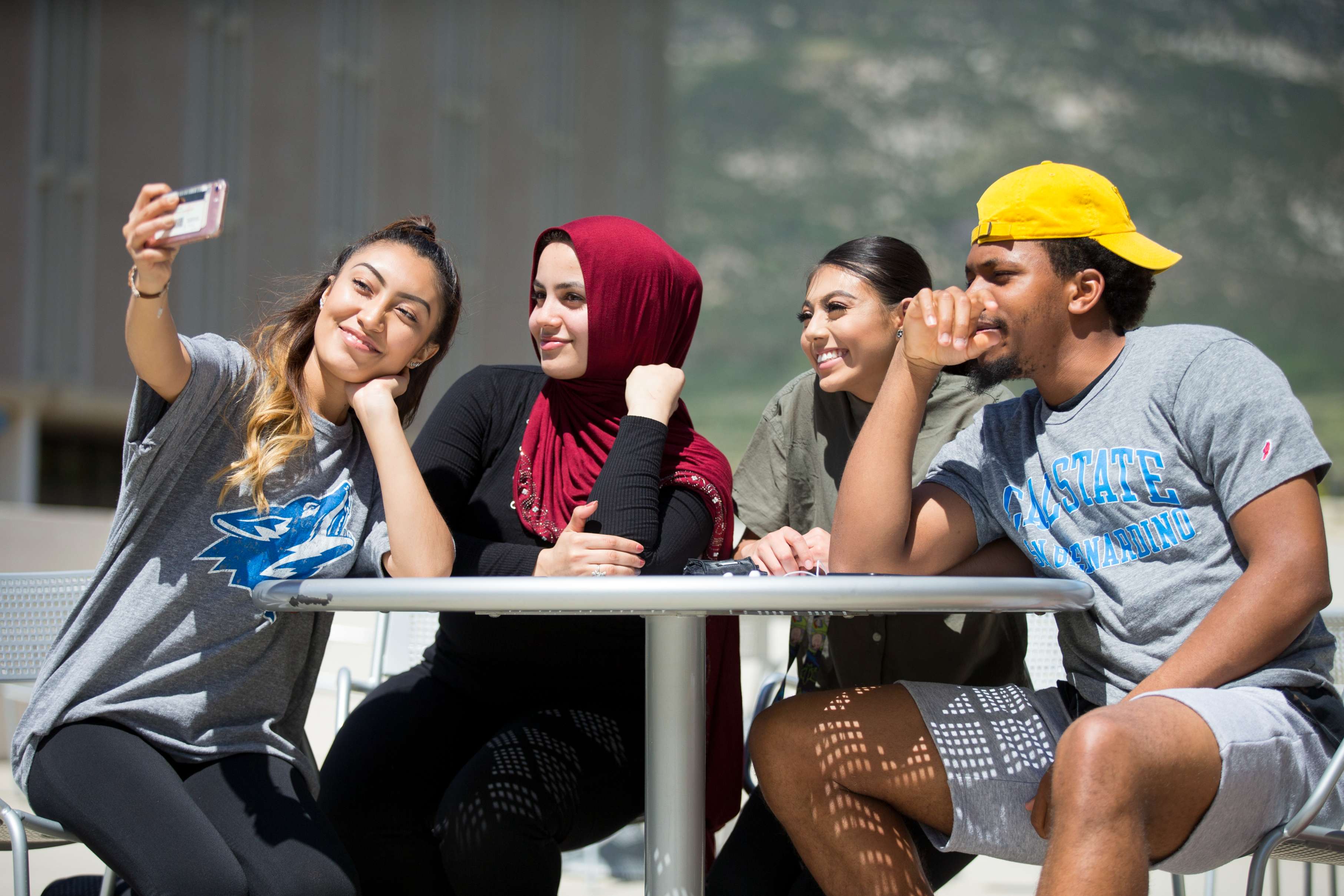 Students talking and laughing at a table