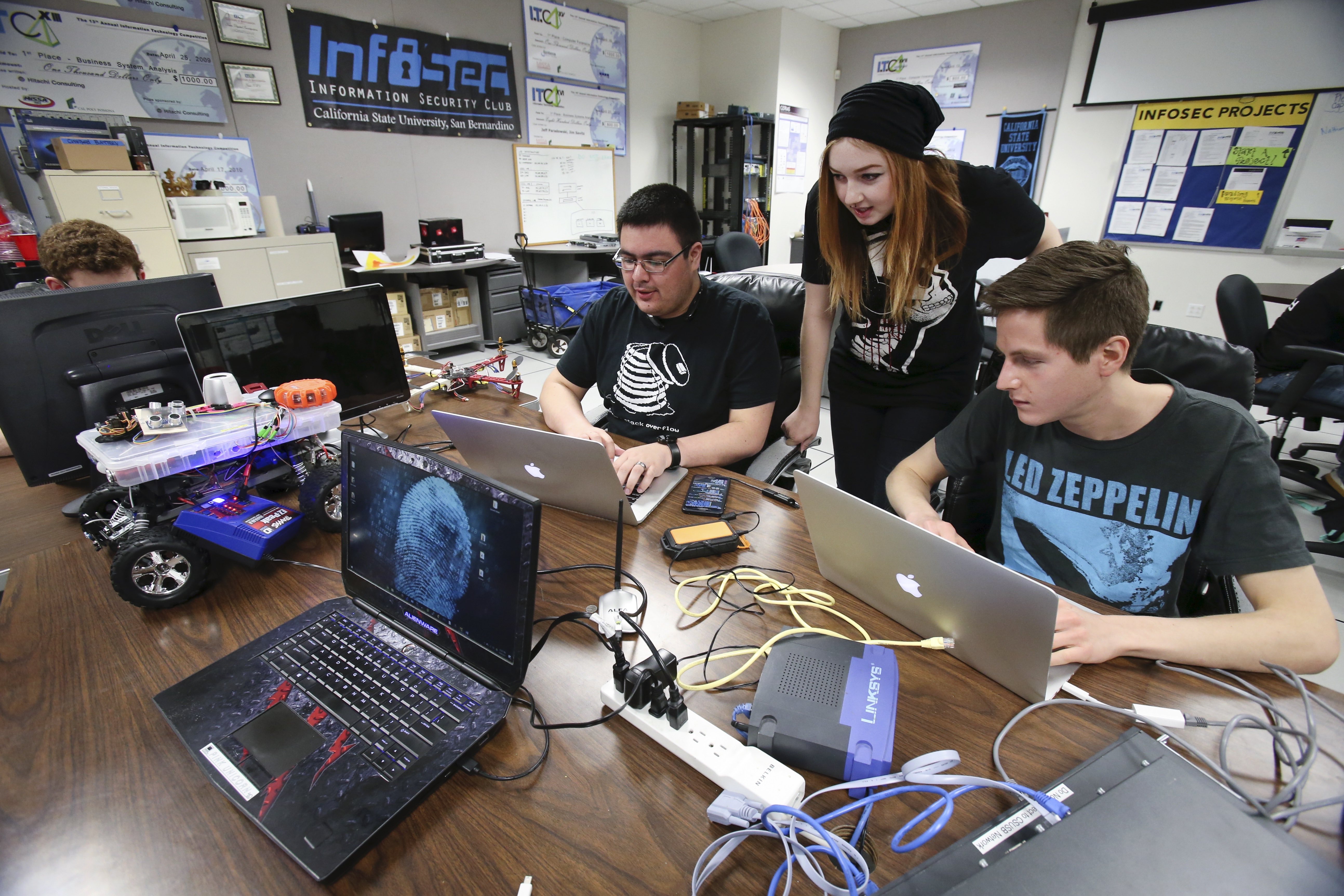 Students working together on a laptop.