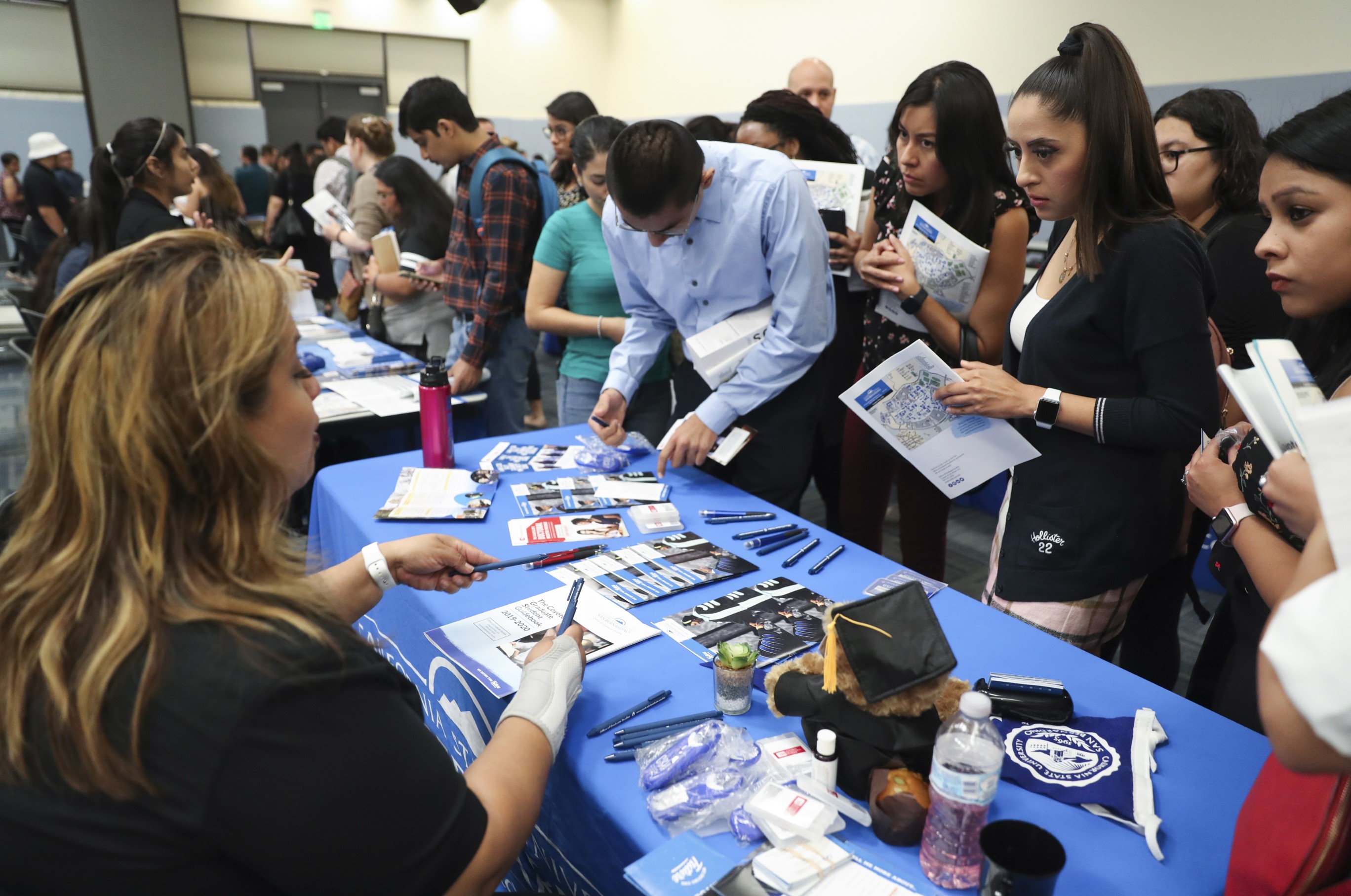 Erma Cross at information table with students