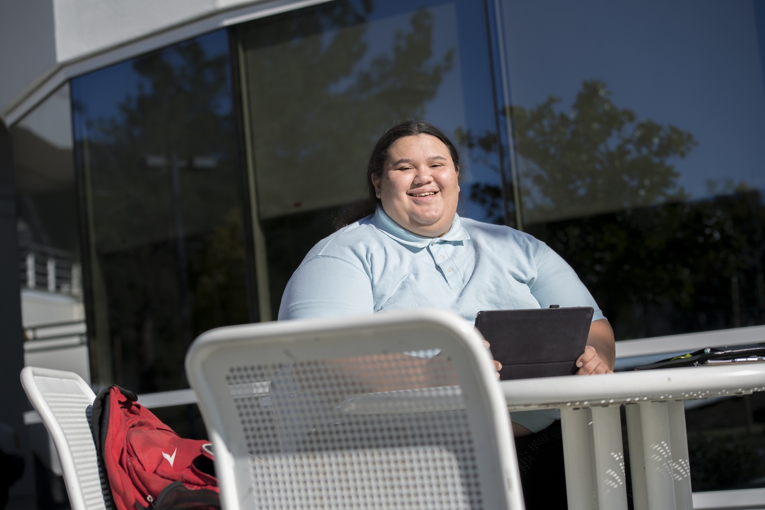 Student posing with laptop.