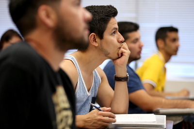 Several Students listening in a classroom