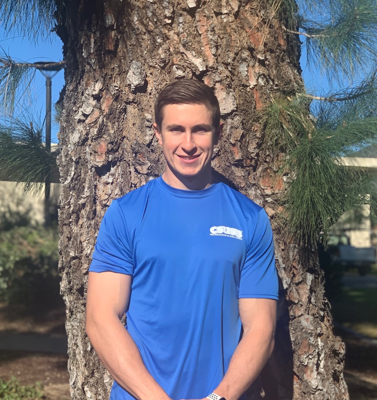 Picture of trainer Jake, outside with background of tree