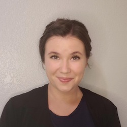 photo of Maya Kratzer smiling with white background