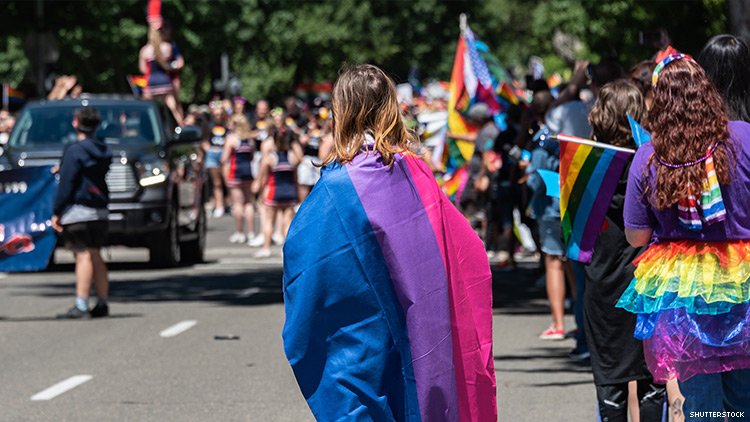 Person wrapped in bisexual pride flag