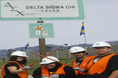 Members of Delta Sigma Chi doing service
