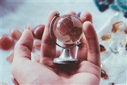 Hand holding a globe