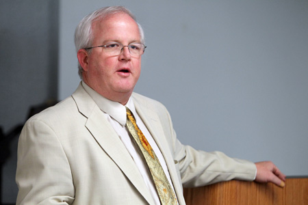 Guy speaking while sitting down