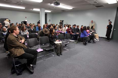 Group of people in room paying attention