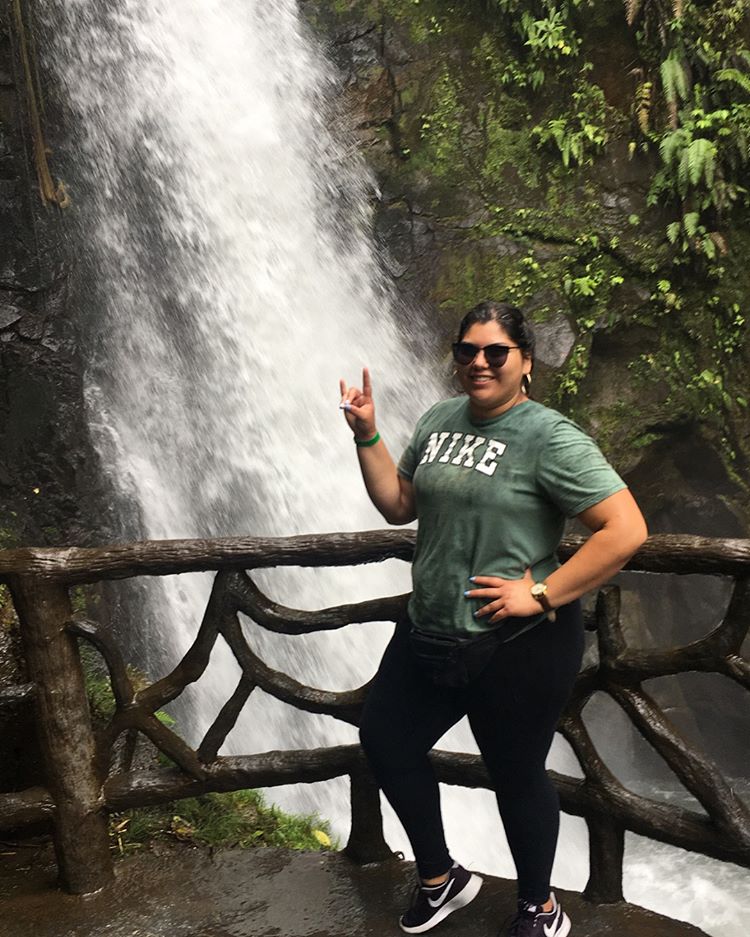 Standing near waterfall