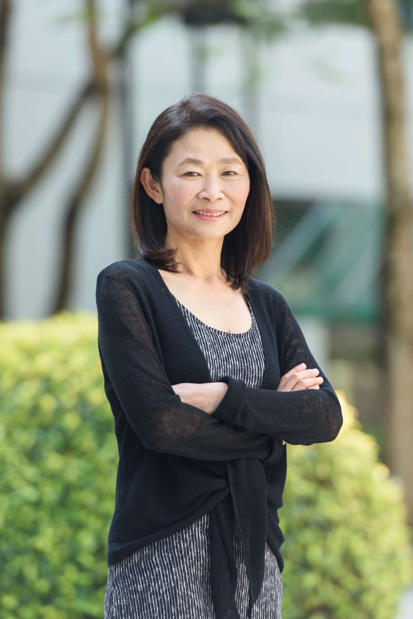 Ching Kwan Lee photo, Chinese woman, striped dress, black sweater