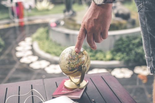 Person touching a globe