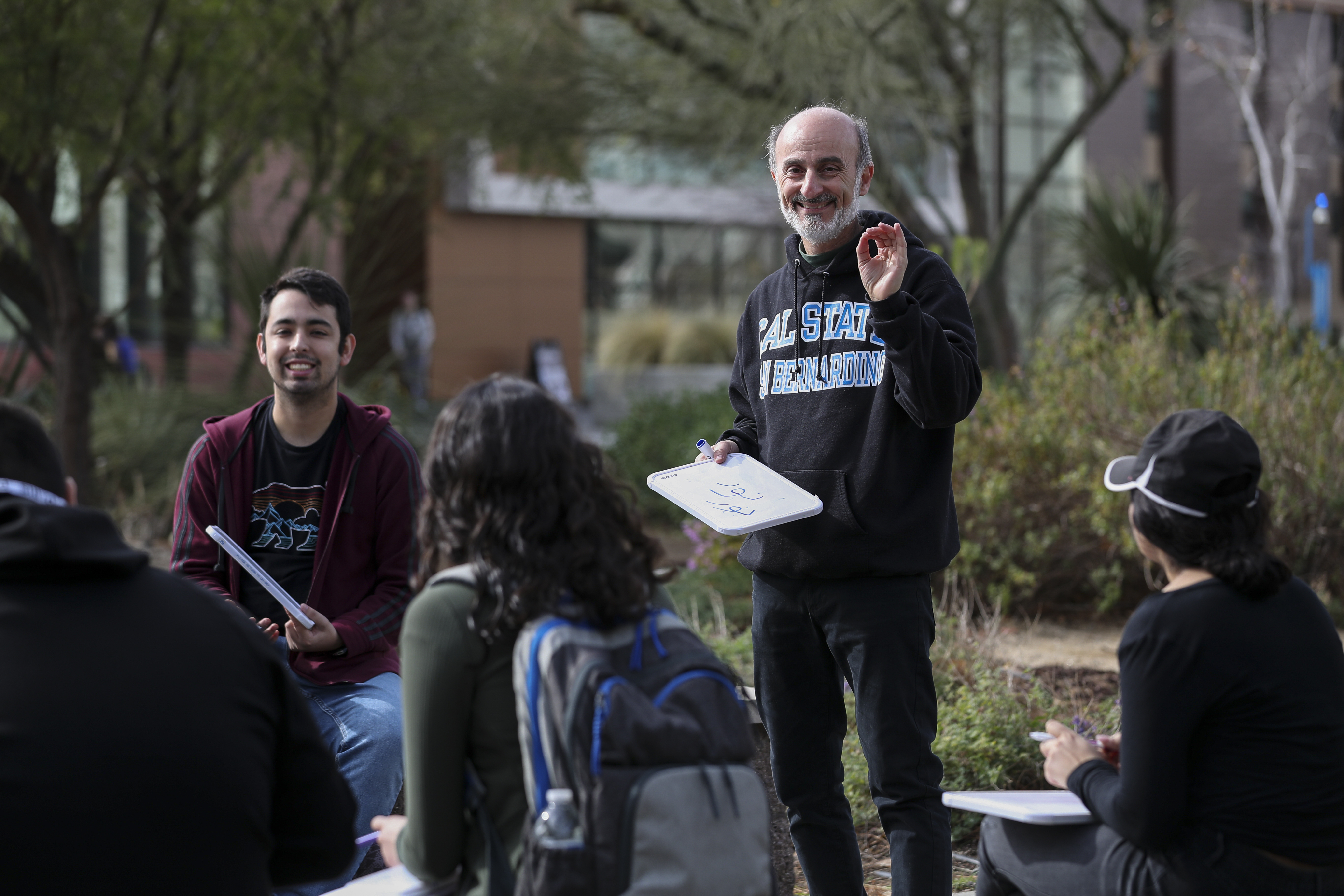 Professor teaching outdoors