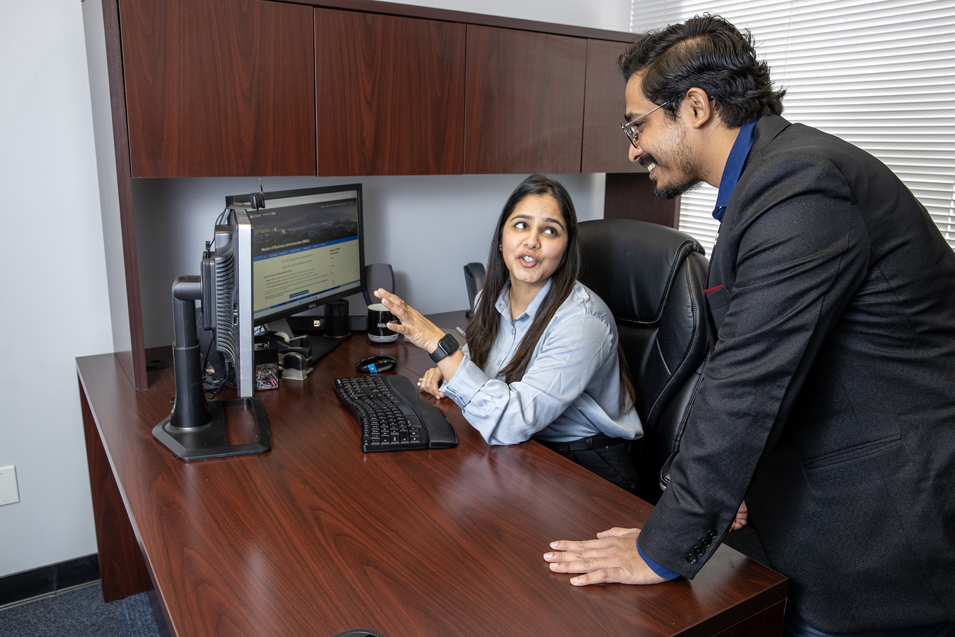 People reviewing notes at computer